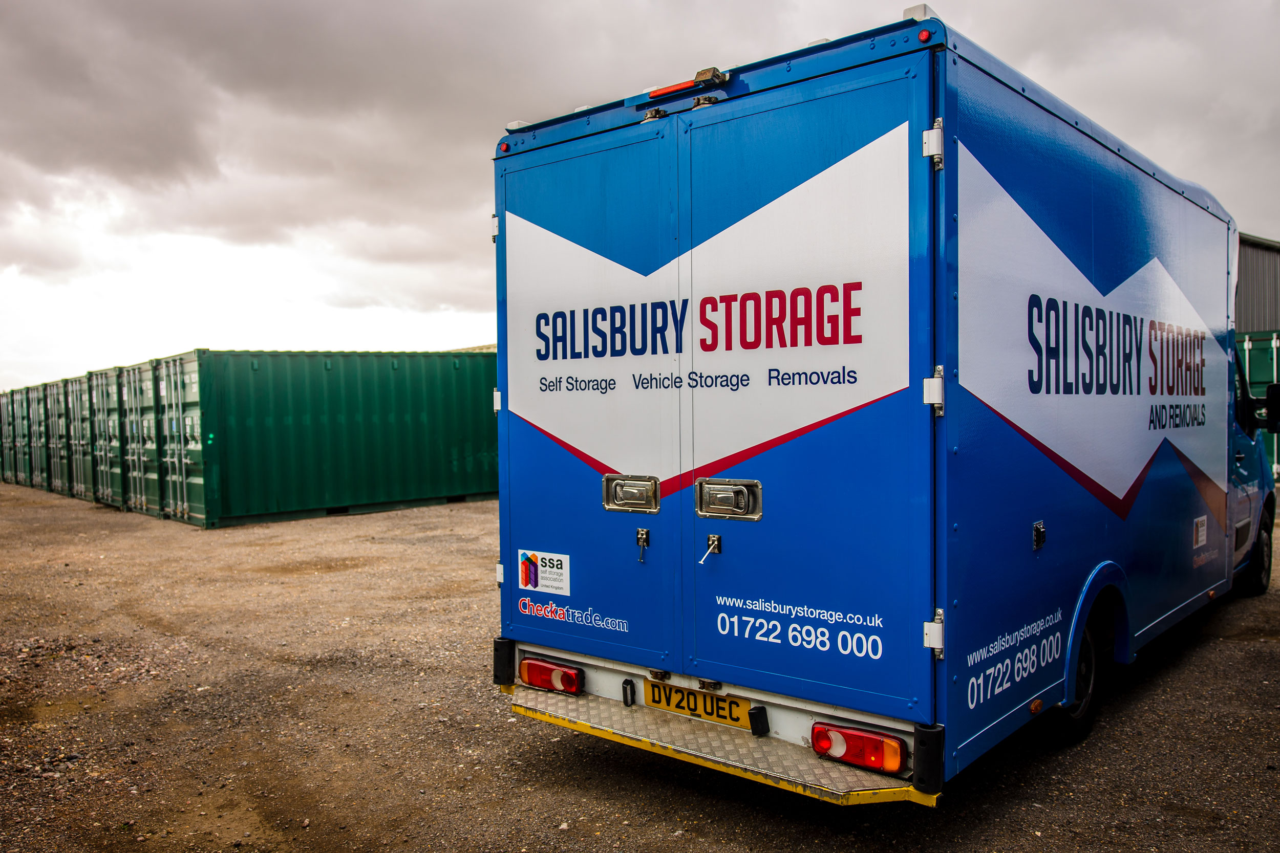 A blue storage lorry, prominently displaying the word "salisbury storage", stands out in its size and colour in front of storage containers.